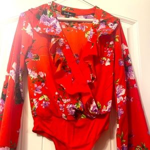 Gorgeous bodysuit. Worn once … bright colors and lightweight fabric .